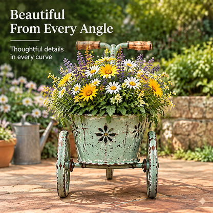 Rear view of a tricycle planter showing floral cutouts and two smaller wheels beside design detail text.