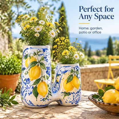 Close-up of yellow lemons, green leaves and blue motifs with text highlighting hand-painted details.